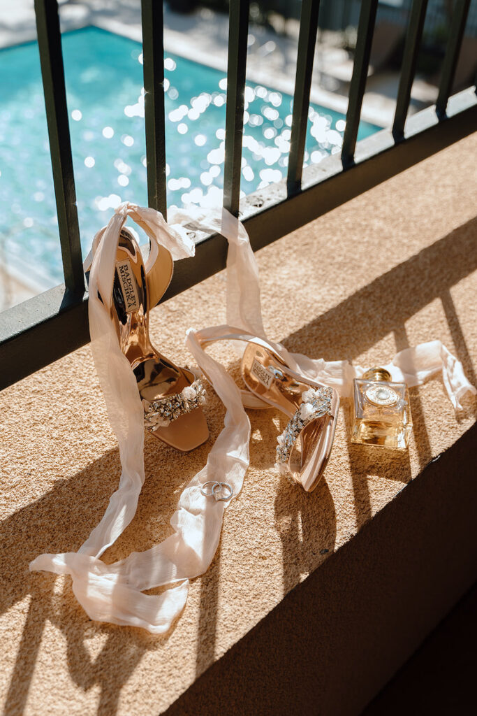 Detail shots of a bride's wedding shoes and perfume