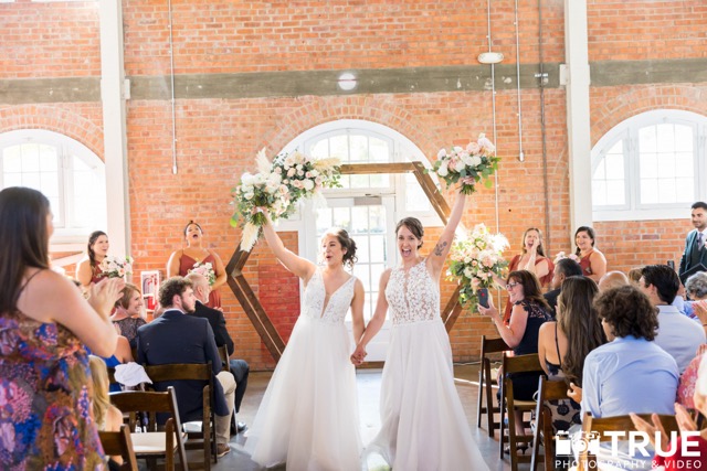 Two brides excited after their wedding ceremony at BRICK