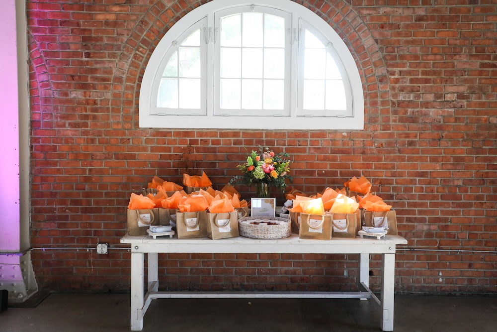 Gift bags set up for a holiday party at BRICK