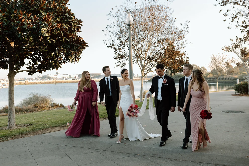 Wedding party walking through the park in San Diego