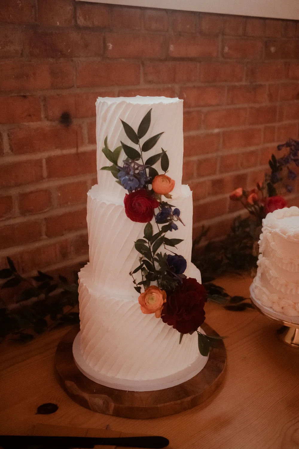 Wedding cake with florals down the side