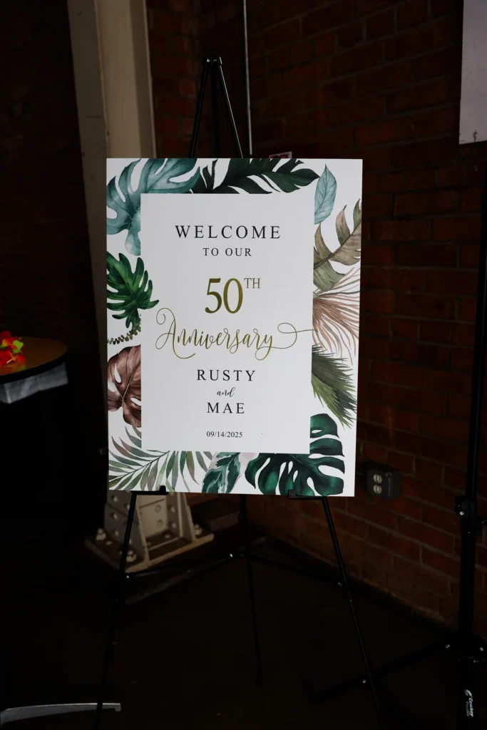 Sign welcoming guests to a 50th anniversary party at BRICK San Diego