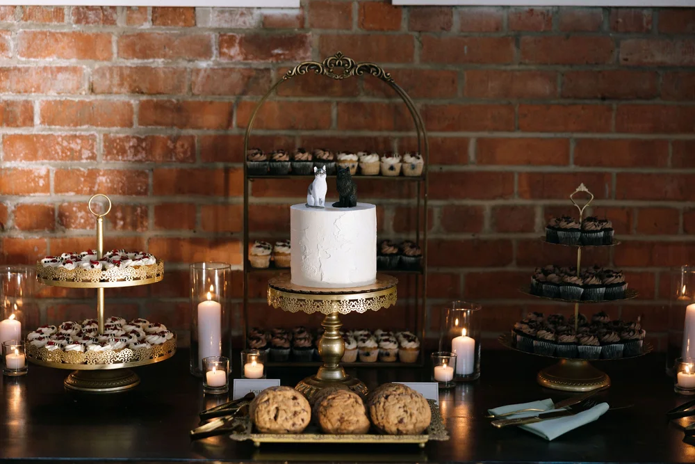 Wedding dessert table at BRICK Liberty Station in San Diego, CA featuring custom sweets and elegant styling
