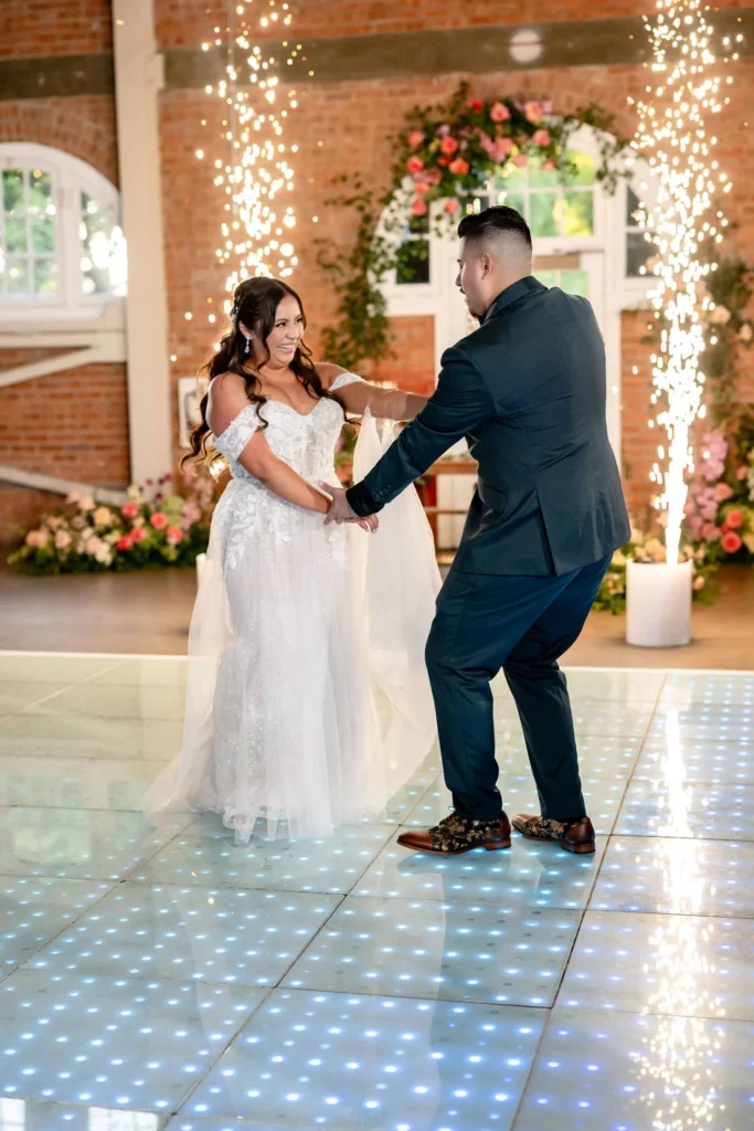 Bride and groom sharing their first dance at BRICK indoor wedding reception venue in San Diego